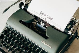 black and white typewriter on white table by Markus Winkler courtesy of Unsplash.