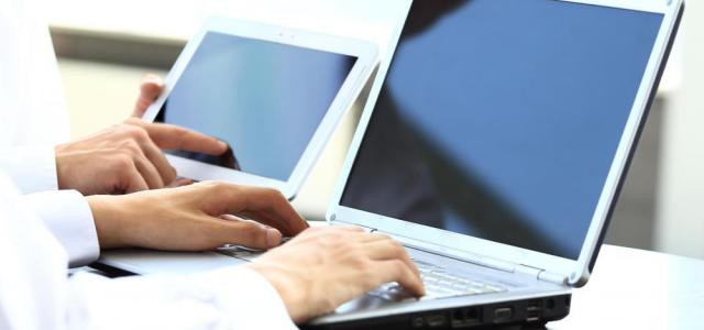 two-people-on-laptop-computers