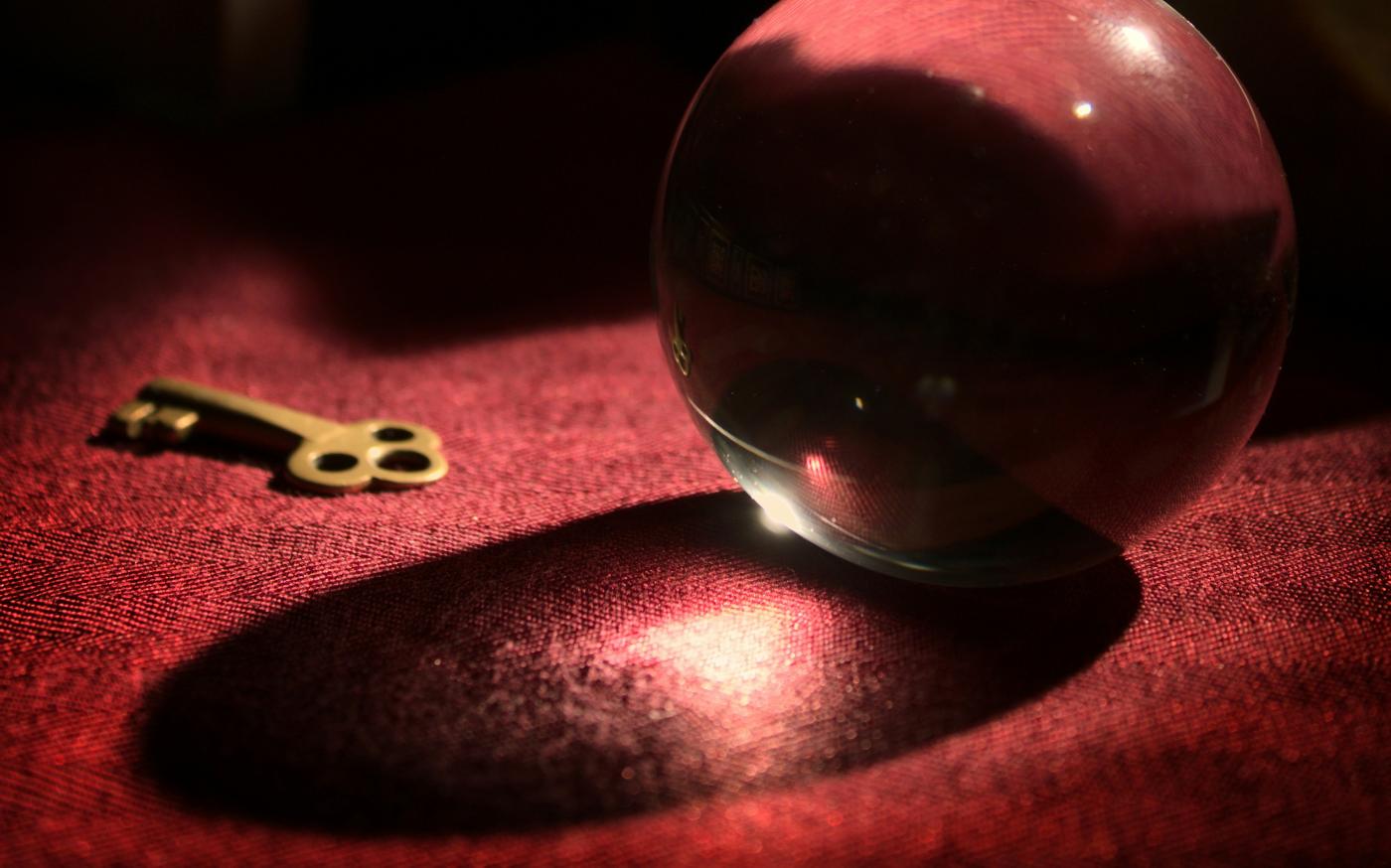 red heart ornament on pink textile by Michael Dziedzic courtesy of Unsplash.