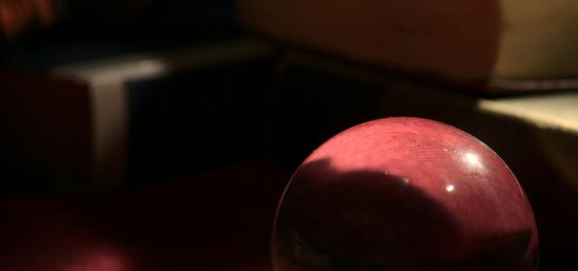 red heart ornament on pink textile by Michael Dziedzic courtesy of Unsplash.